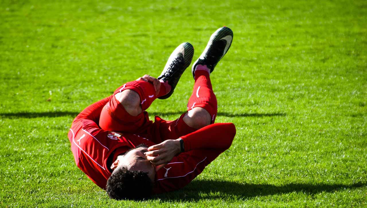 Muscle Cramps Football Player With Muscle Cramp